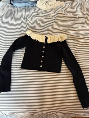 Black Ribbed Button-Up Cardigan with Cream Ruffle Collar